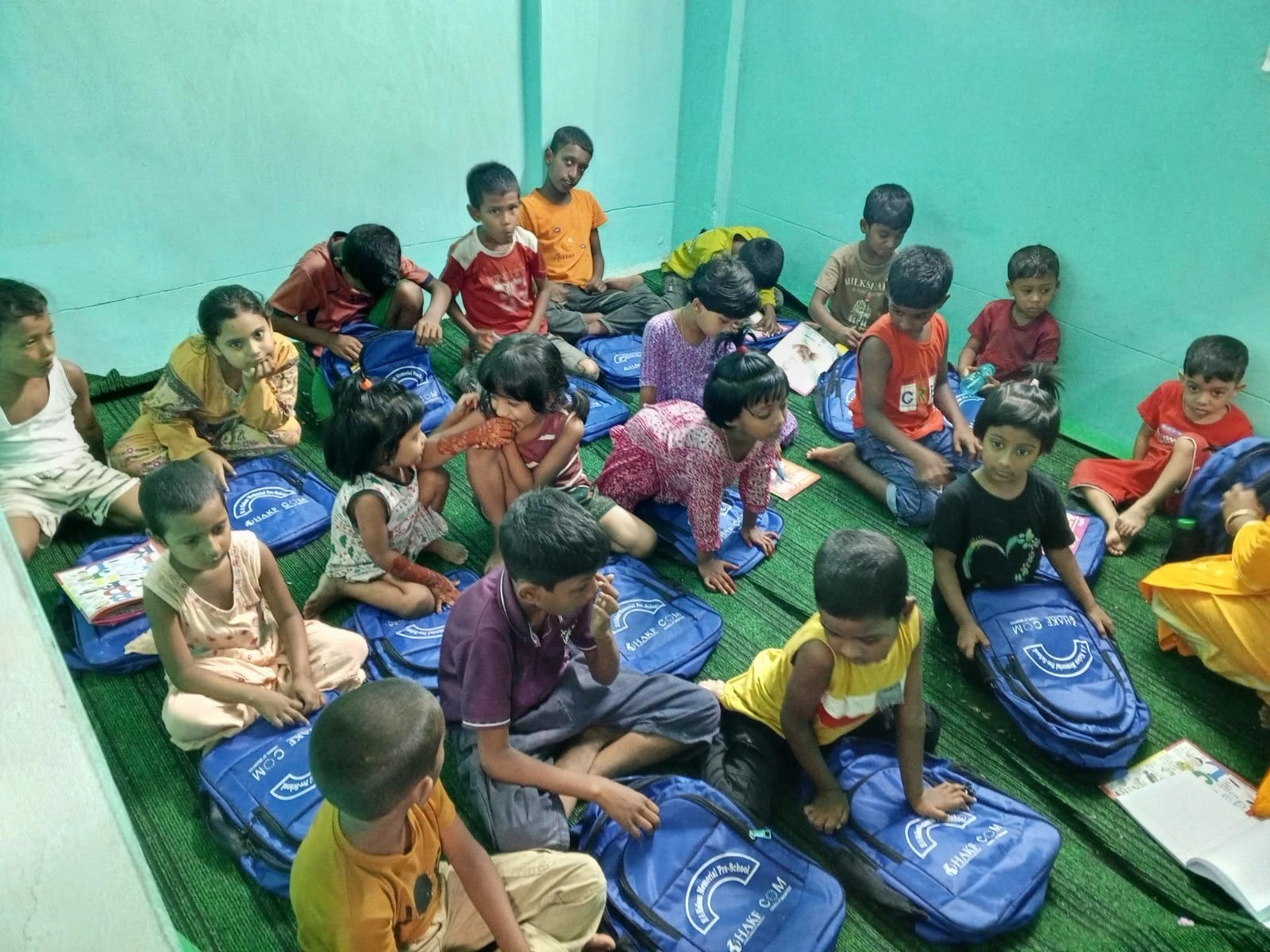 Young children at a HAKF pre-primary center with new school bags