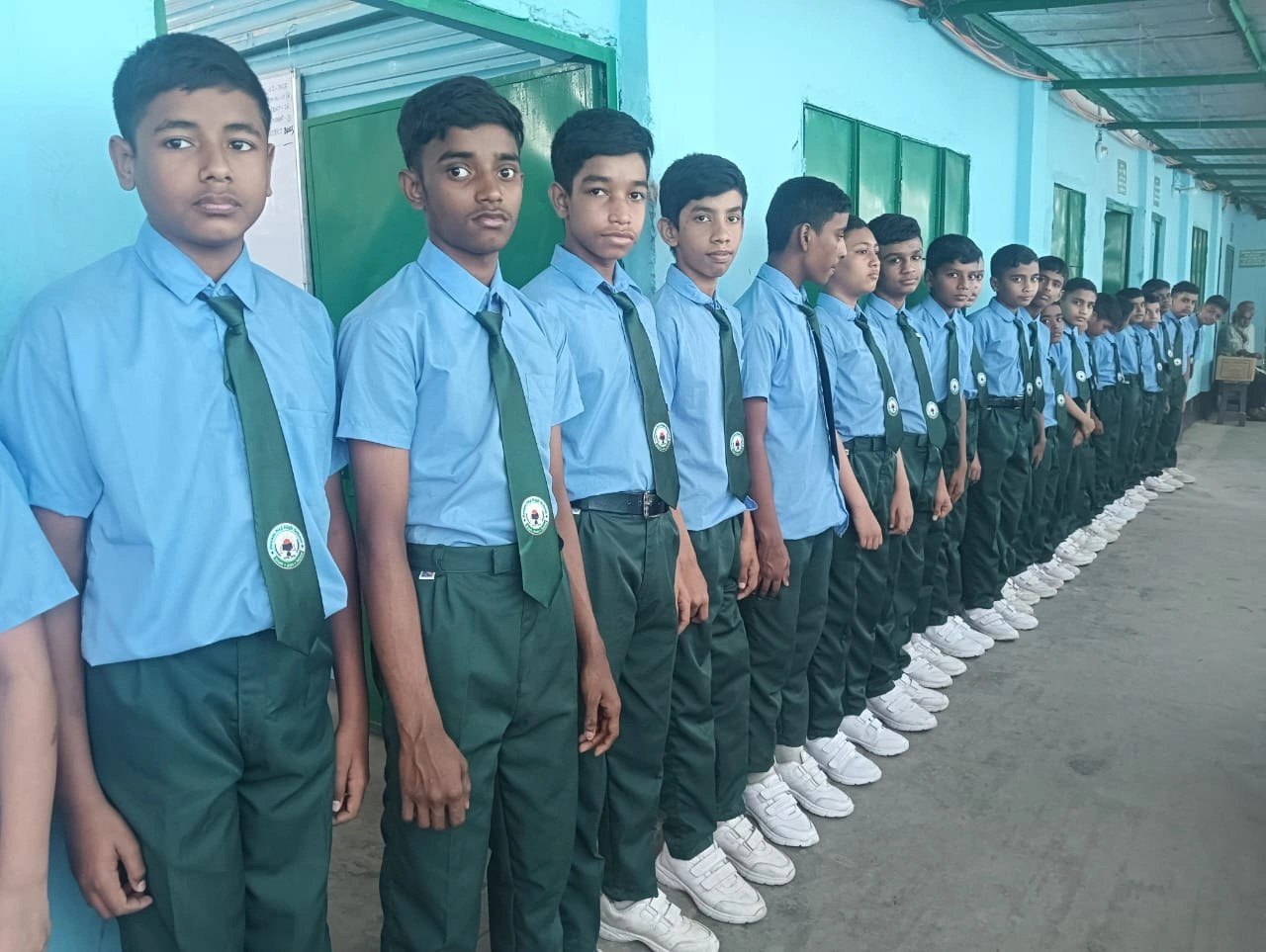 Students in school uniform lined up for morning assembly